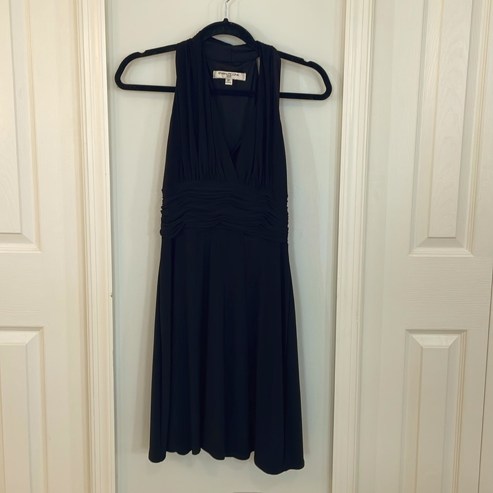 LBD. Stretch knit halter top. Rushed at waist.  Butterfly back.